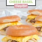 Several homemade McDonald's steak bagel breakfast sandwiches.