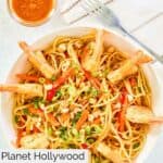 Overhead view of homemade Planet Hollywood Thai shrimp pasta in a white bowl.