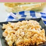 Ritz cracker chicken casserole serving on a square black plate.