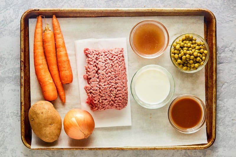 Shepherd's pie with beef ingredients on a tray.