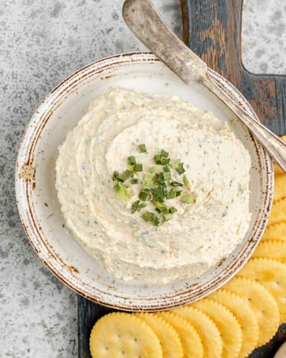 Overhead view of homemade boursin cheese and crackers next to it.