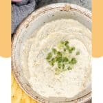 Overhead view of homemade boursin cheese on a plate.