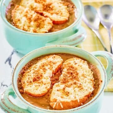 Copycat Brennan's French onion soup in two soup crocks.