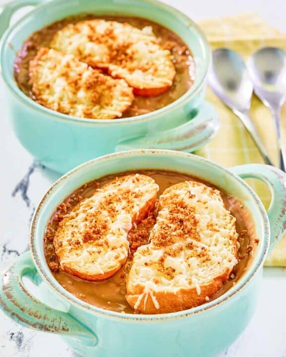 Copycat Brennan's French onion soup in two soup crocks.