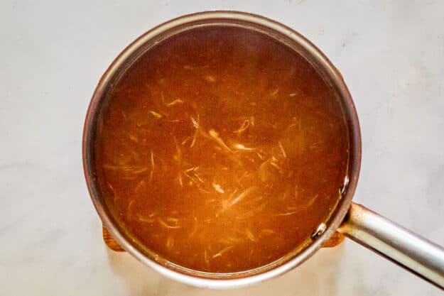 French onion soup in a pot.