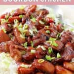 Homemade Cajun Cafe bourbon chicken over rice on a platter.