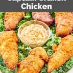 Homemade Planet Hollywood Captain Crunch chicken tenders on top of kale on a platter.