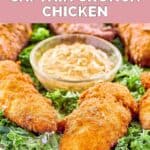 Homemade Planet Hollywood Captain Crunch chicken tenders on top of kale on a platter.