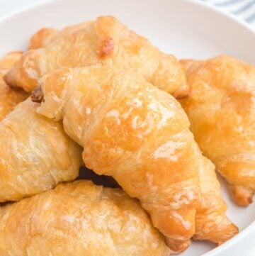 Copycat Cheddar's honey butter croissants on a plate.