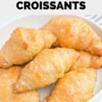 Homemade Cheddar's honey butter croissants on a plate.