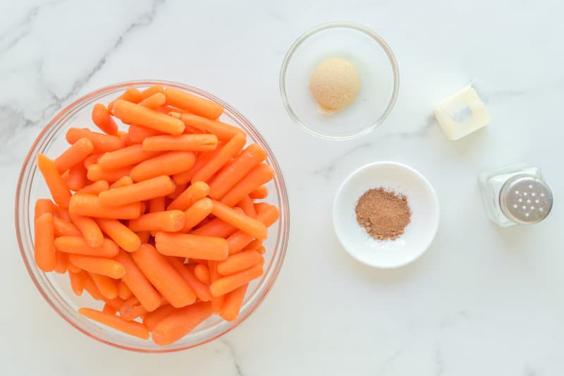 Copycat Cracker Barrel baby carrots ingredients on a marble surface.