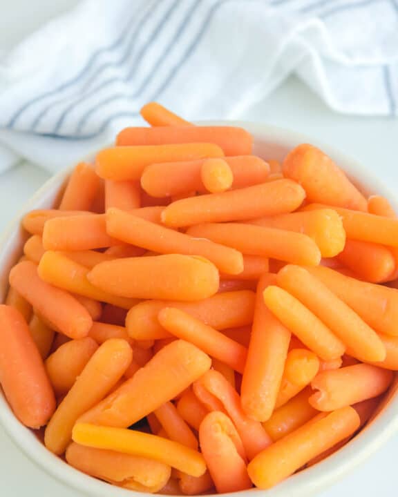 Copycat Cracker Barrel baby carrots in a white bowl.
