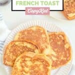 Overhead view of homemade Cracker Barrel French toast on a white plate.