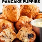 Homemade Denny's blueberry pancake puppies piled on a black plate.