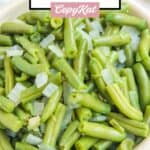 A bowl of homemade KFC green beans with onions.