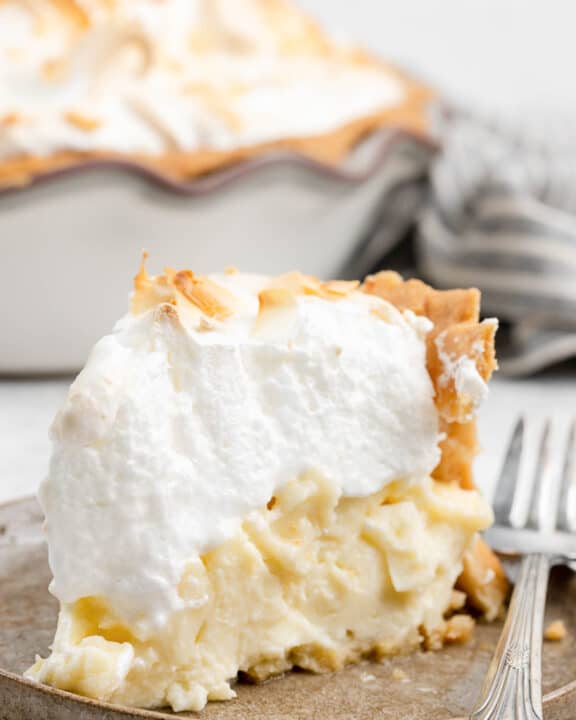 Copycat Luby's coconut meringue pie slice on a plate.