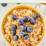 Overhead view of overnight oats topped with fresh blueberries.
