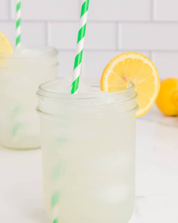 Copycat Starbucks lemonade garnished with a lemon slice.