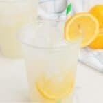 Homemade Starbucks lemonade in a clear plastic cup.