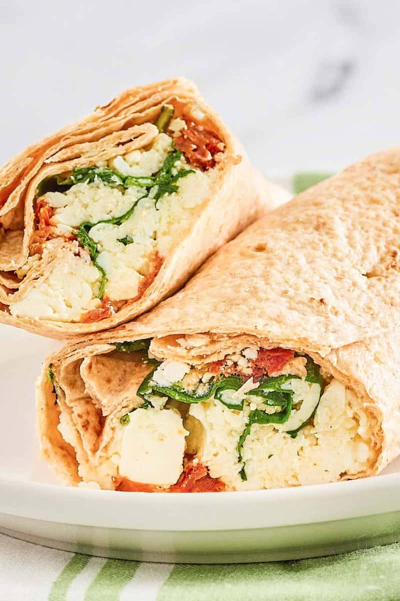 Closeup of copycat Starbucks spinach feta wrap on a plate.