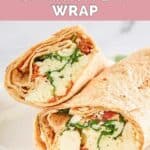 Closeup of a homemade Starbucks spinach feta wrap on a white plate.