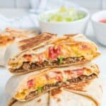 Copycat Taco Bell crunchwrap supreme on a marble surface.