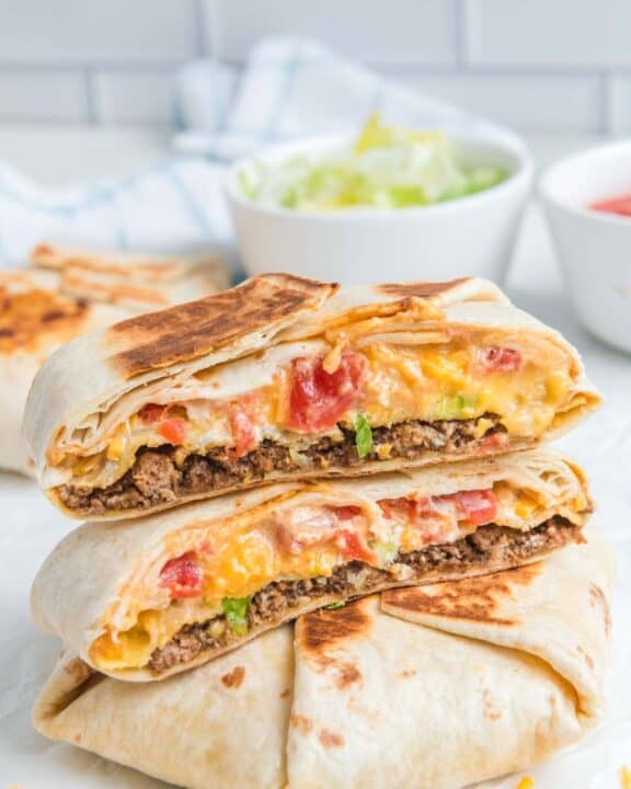 Copycat Taco Bell crunchwrap supreme on a marble surface.