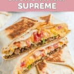 Two Taco Bell crunchwrap supremes and one cut in half.