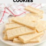 Homemade Walkers shortbread cookies piled on a plate.