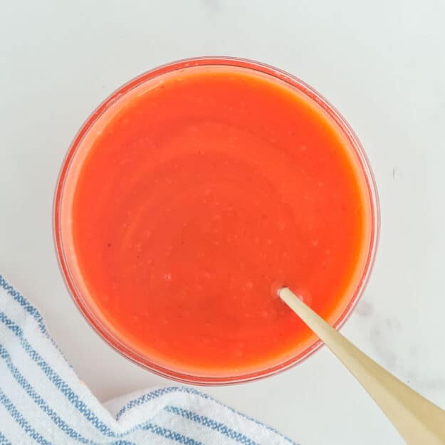 Copycat Chick Fil A Polynesian sauce and a spoon in a glass bowl.