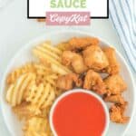 Overhead view of homemade Chick Fil A Polynesian sauce, chicken nuggets, and waffle fries.