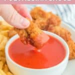 Dipping a chicken nugget into homemade Chick Fil A Polynesian sauce.