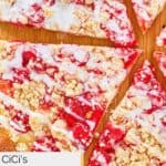 Closeup of cherry dessert pizza slices.