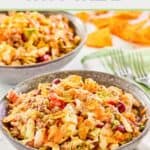 Dorito taco salad in bowls, forks, and Doritos chips.