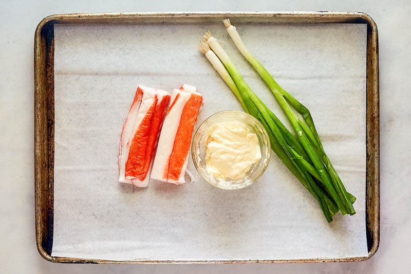 Imitation crab salad ingredients on a tray.