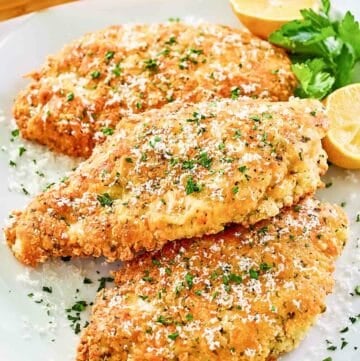 Copycat Luby's Italian chicken breast on a platter.