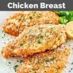 Homemade Luby's Italian chicken breast, lemon half, and fresh parsley.