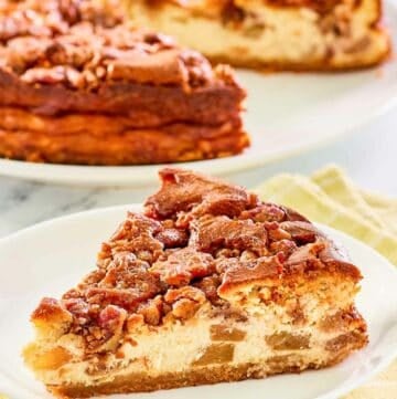 Copycat Olive Garden apple praline cheesecake on a plate and the cheesecake behind it.