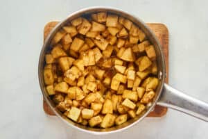 Cooked apples in a saucepan.