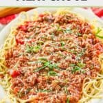 Homemade spaghetti meat sauce and spaghetti pasta on a platter.