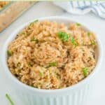 Homemade Texas Roadhouse seasoned rice in a white bowl.