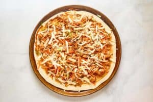 Copycat CPK Thai chicken pizza before baking.