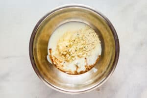 Copycat Wingstop blue cheese dip ingredients in a mixing bowl.