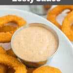 Homemade Burger King zesty sauce and onion rings on a white plate.