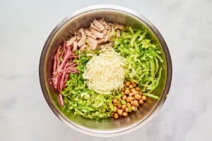 California Pizza Kitchen Italian chopped salad ingredients in a large bowl.