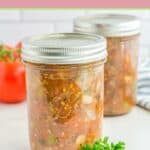 Two jars of homemade canned spaghetti sauce.