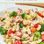 Chicken pasta salad with broccoli on a platter.