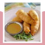 Copycat Chili's chicken crispers and honey mustard dipping sauce on a plate.