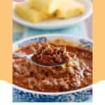 A spoonful of copycat Chili's original chili over a bowl of it.
