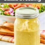 Green onion vinaigrette salad dressing in a glass mason jar.